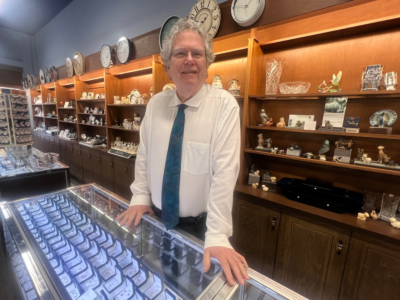 A man stands at the front counter of his jewellry store in Ingersoll, Ontario.