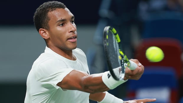 Montreal's Felix Auger-Aliassime claimed his eighth career title and his third of the year on Sunday at the European Open in Brussels. A male tennis player returns a shot with the racket in his right hand.