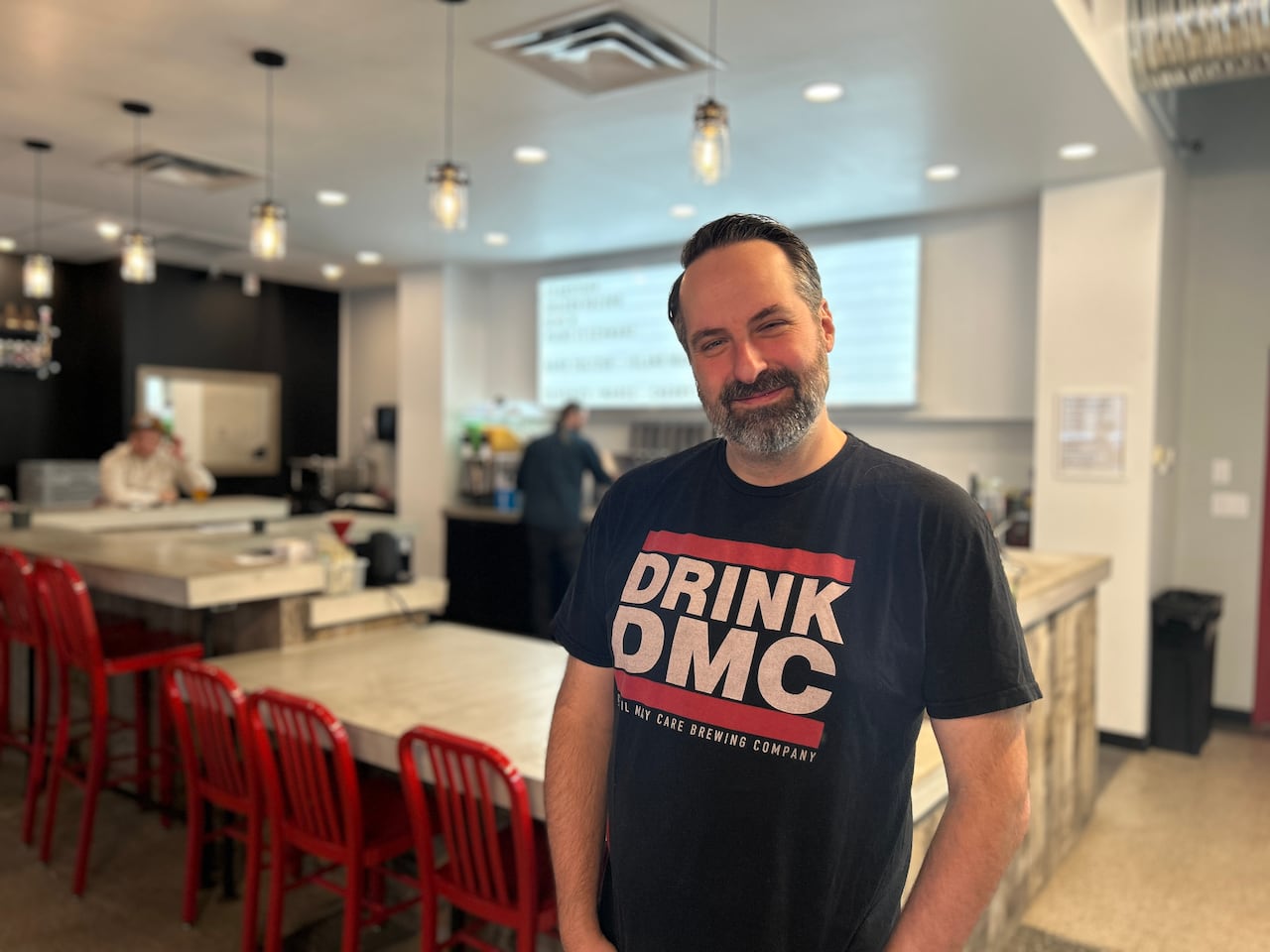 A man looks at the camera