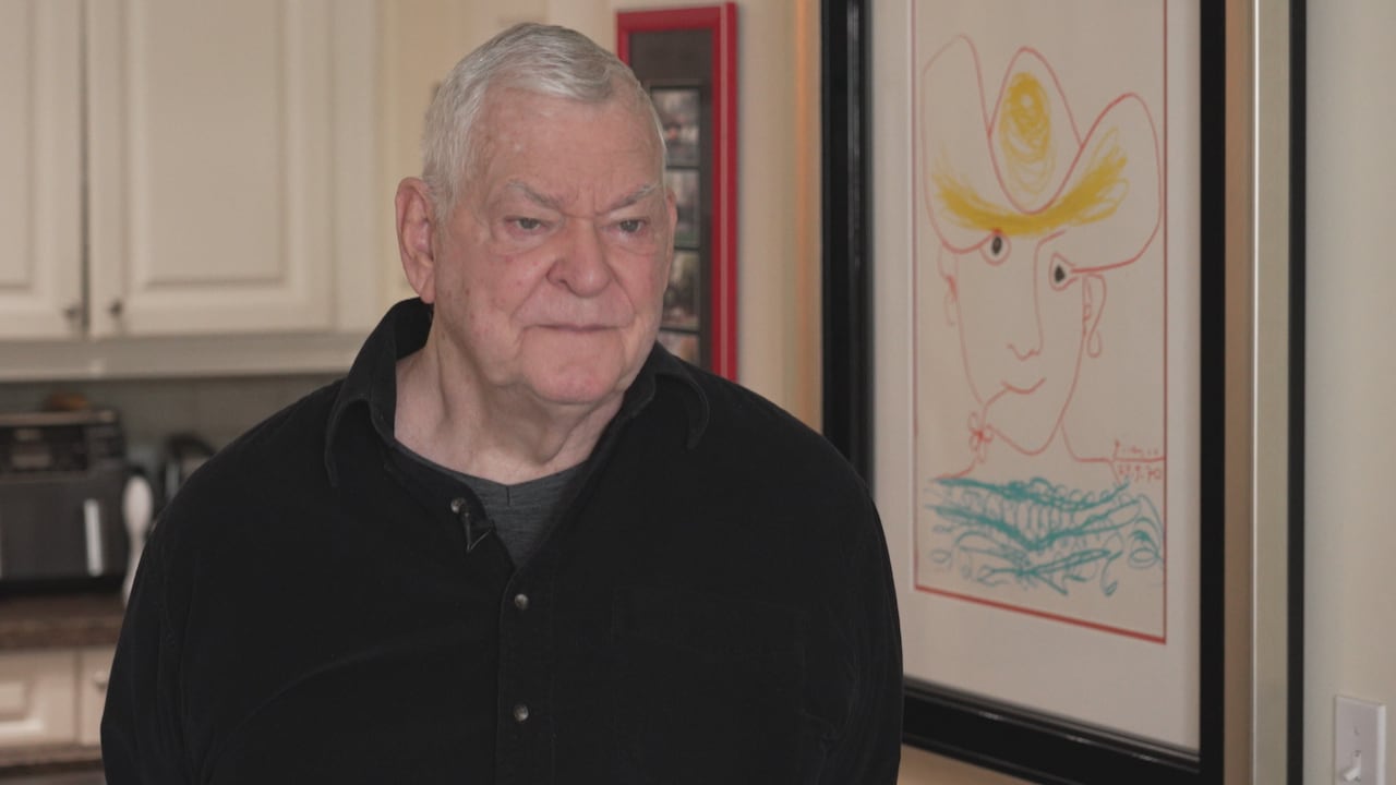 Warren Shepell sitting in his kitchen.