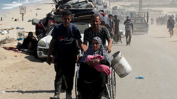 Displaced Palestinians fleeing northern Gaza