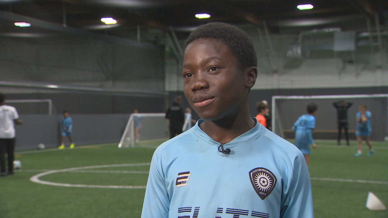 11 year old boy on pitch being interviewed by CBC