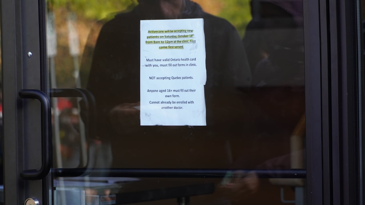 Paper posted in the window of a door.