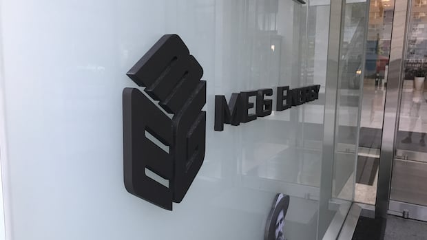 Corporate logo on wall outside entrance to MEG Energy building in downtown Calgary.