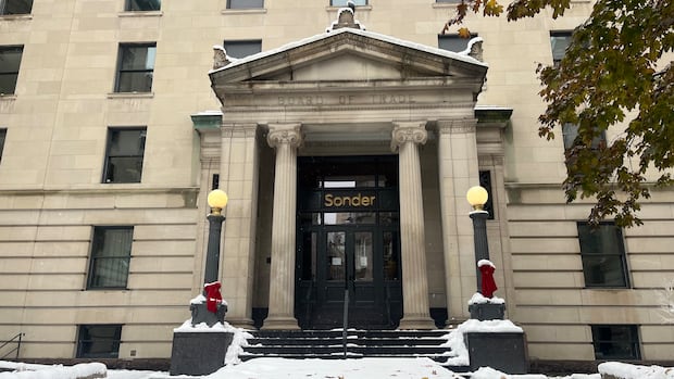 outside of an old building with large pillars. the sign above the door in lowercase letters reads "Sonder"