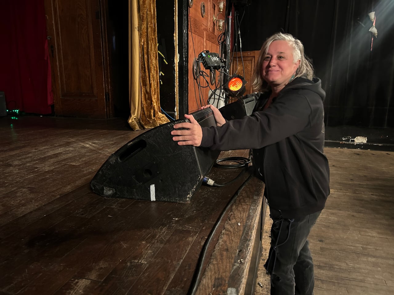 Woman with speaker at Casa Del Popolo