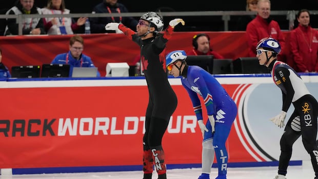 Canada's William Dandjinou celebrates in Milan, Italy, on Feb. 16, 2025.