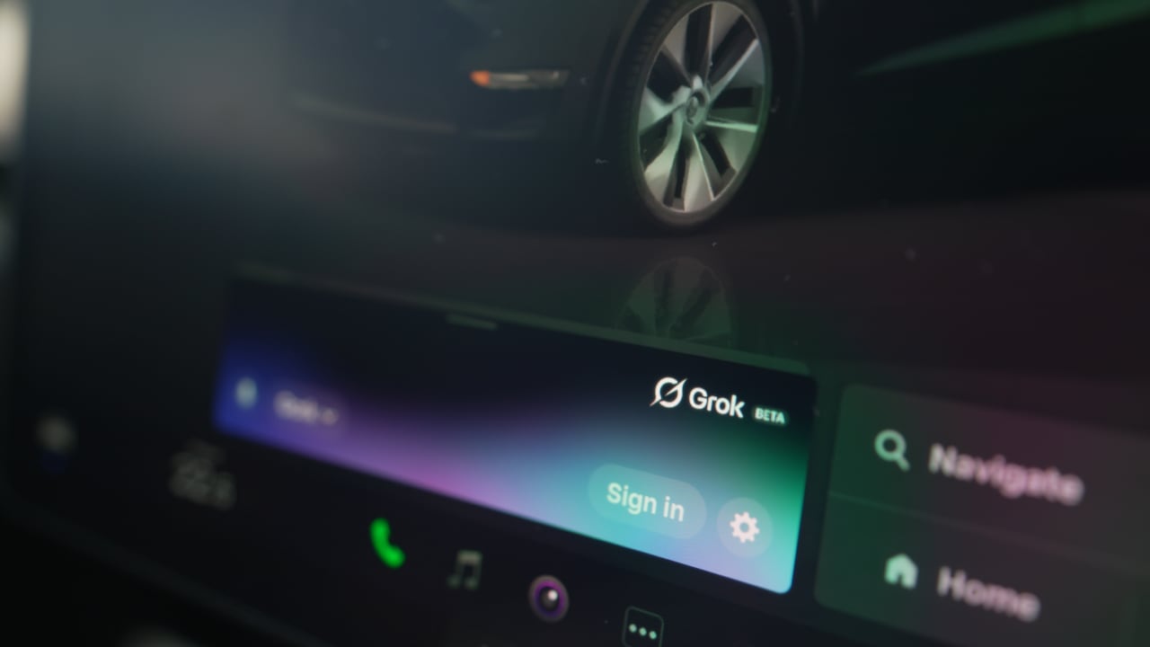 Grok sign-in screen inside a Tesla on a display monitor