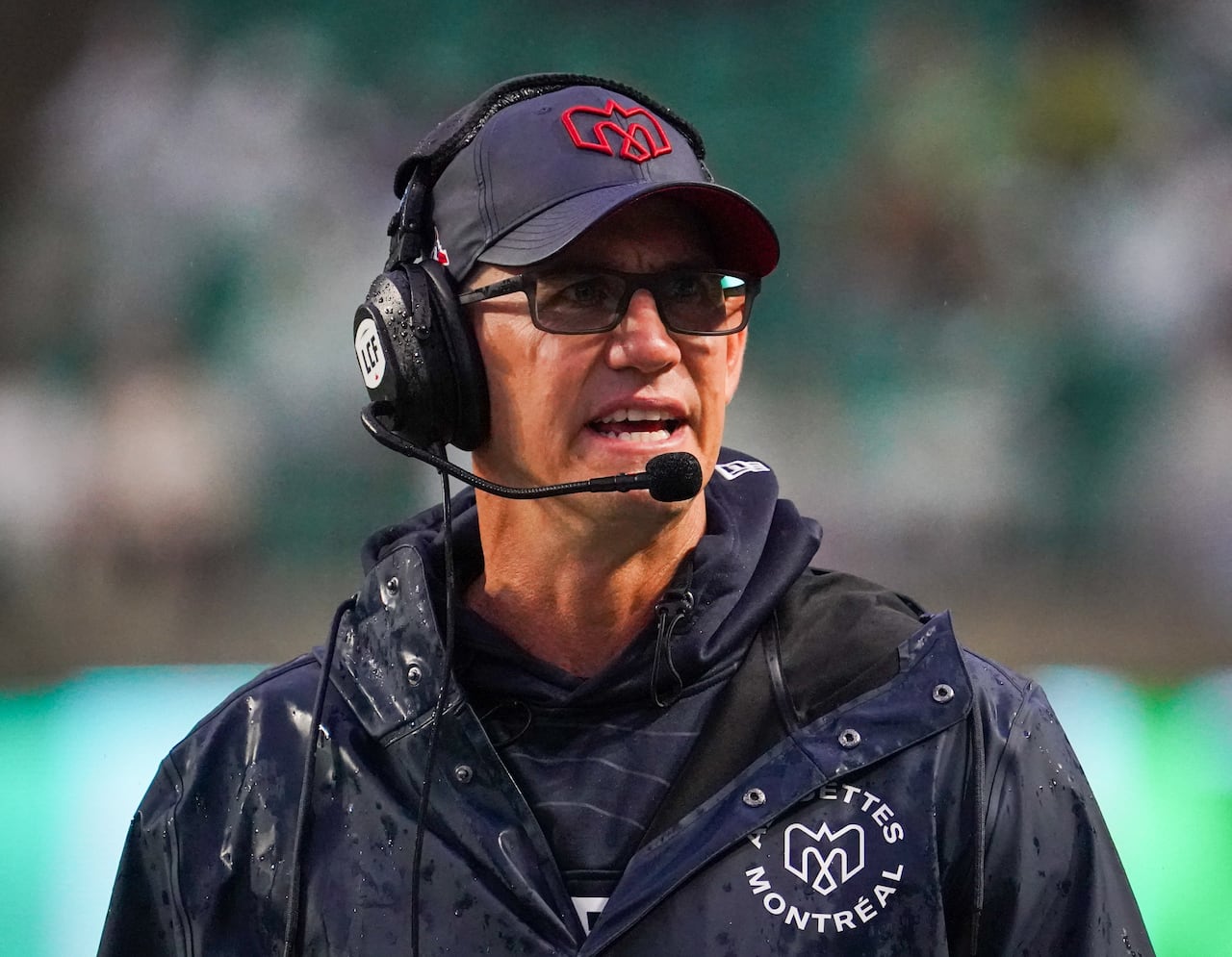 Montreal Alouettes head coach Jason Maas watches a CFL football game.