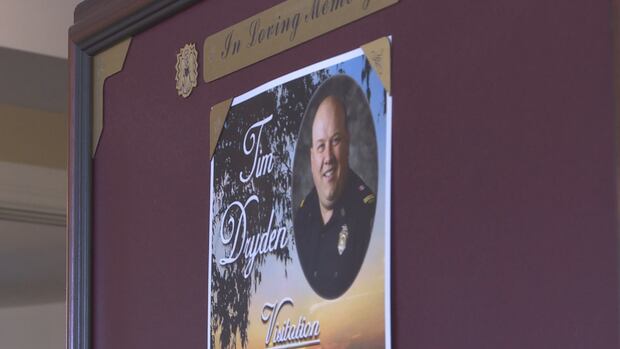 Hundreds gathered Saturday to remember Salisbury fire captain after his sudden death at home last week. a firefighters photo at a memorial service