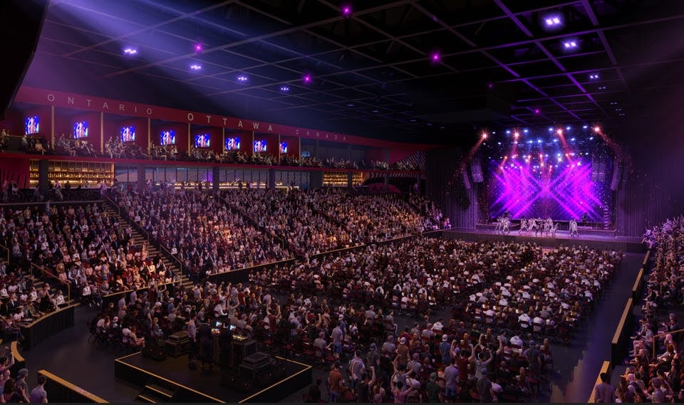 The inside of a stadium, set up like a bowl for a concert or show.