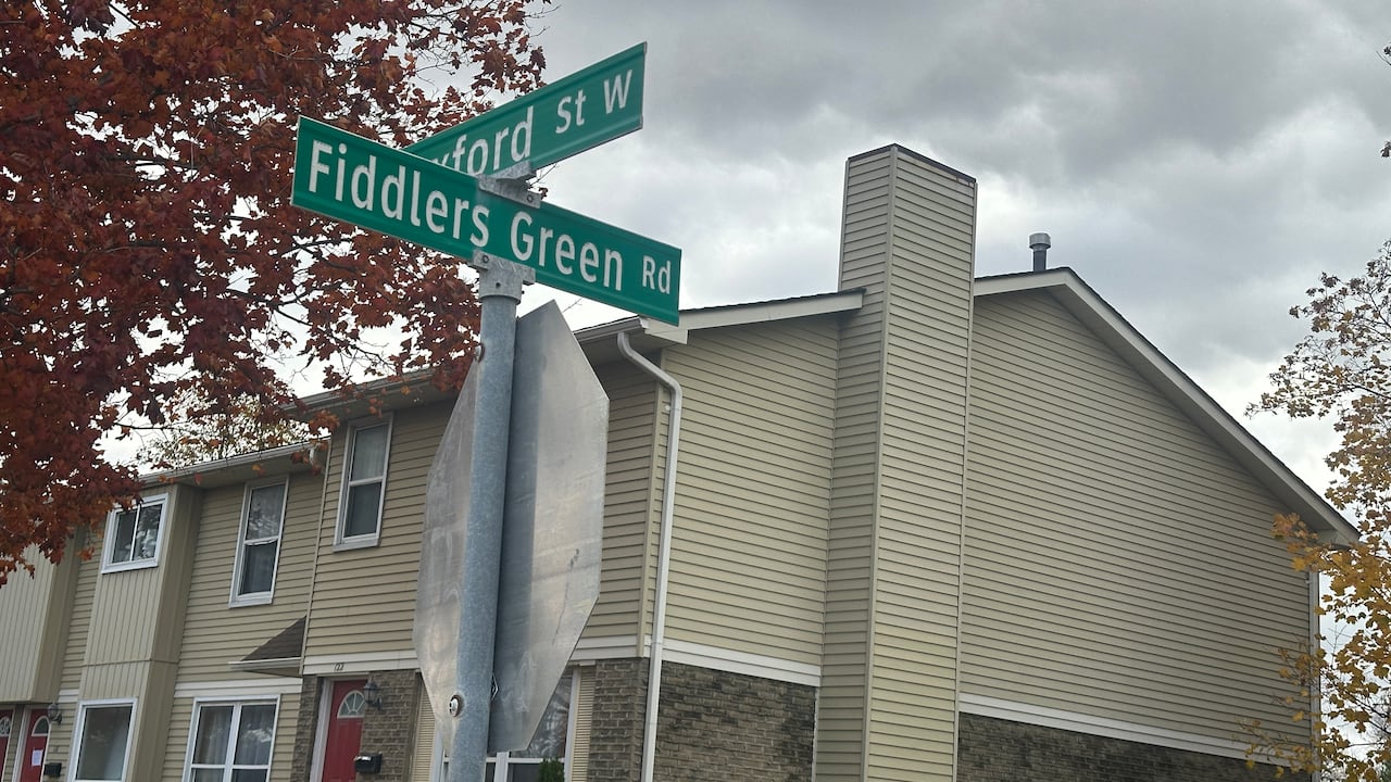 Two thoroughfare  signs and a halt  sign. Camera pointing upward