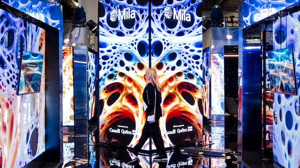 A woman walks through a futuristics looking animated billboard