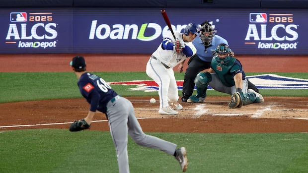 A baseball player hits a ball.