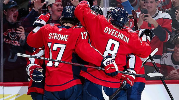  The Washington Capitals celebrate after scoring a goal against the visiting Seattle Kraken in an October 21, 2025 NHL regular-season game at Capital One Arena in DC.