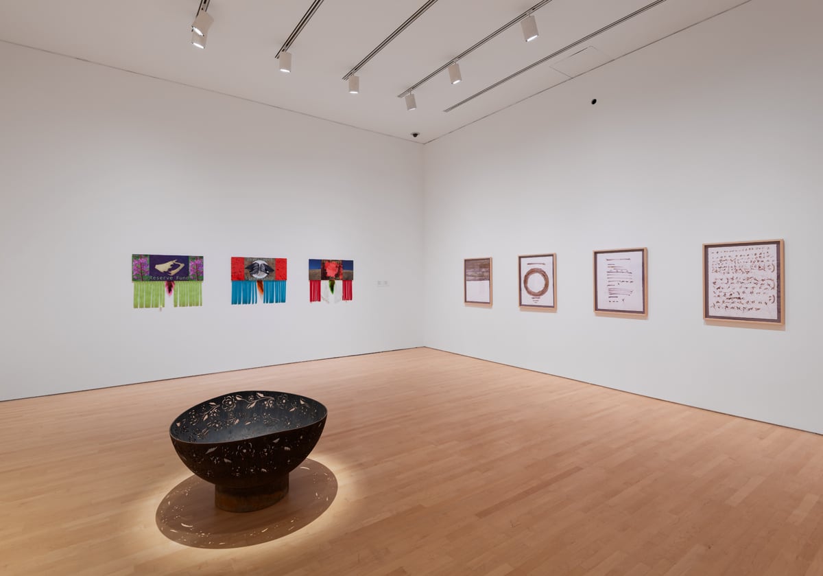 A metallic  occurrence  pit sits successful  the centre of a white-walled assemblage   abstraction  with artworks hanging from the walls behind.