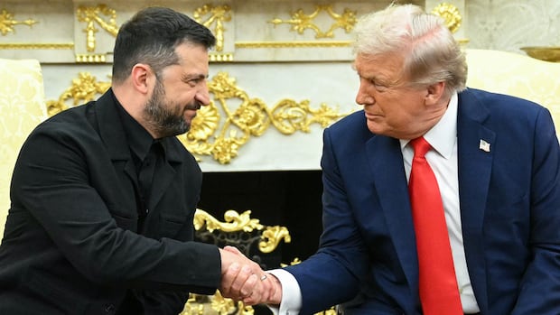 Ukrainian President Volodymyr Zelensky and US President Donald Trump shake hands during a meeting in the Oval Office of the White House