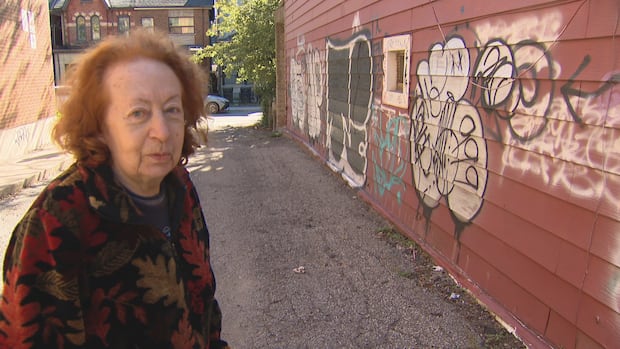 Cristina Enrietti, who owns three Oxford Street houses adjacent to Ellen Avenue, stands beside her house, the side of which is routinely covered in graffiti. She says she wants the city to do something to clear up the problem of orphaned properties. Cristina Enrietti, who owns three Oxford Street houses adjacent to Ellen Avenue, says she wants the city to do something to clear up the problem of orphaned properties so they can be properly maintained.