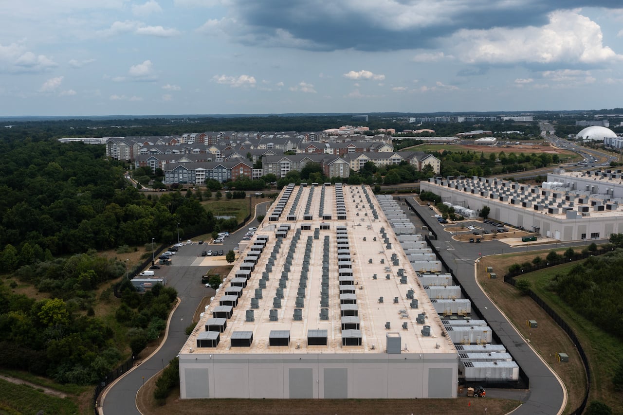 ASHBURN, VIRGINIA - JULY 17: In an aerial view, the IAD71 Amazon Web Services data center is shown on July 17, 2024 in Ashburn, Virginia. Northern Virginia is the largest data center market in the world, according to a report this year cited in publ