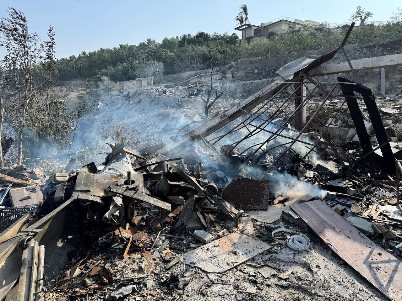 Smoke rises from a site damaged by Israeli strikes.