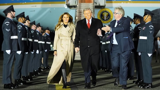 President Donald Trump and first lady Melania Trump arrive at Stansted Airport near London.