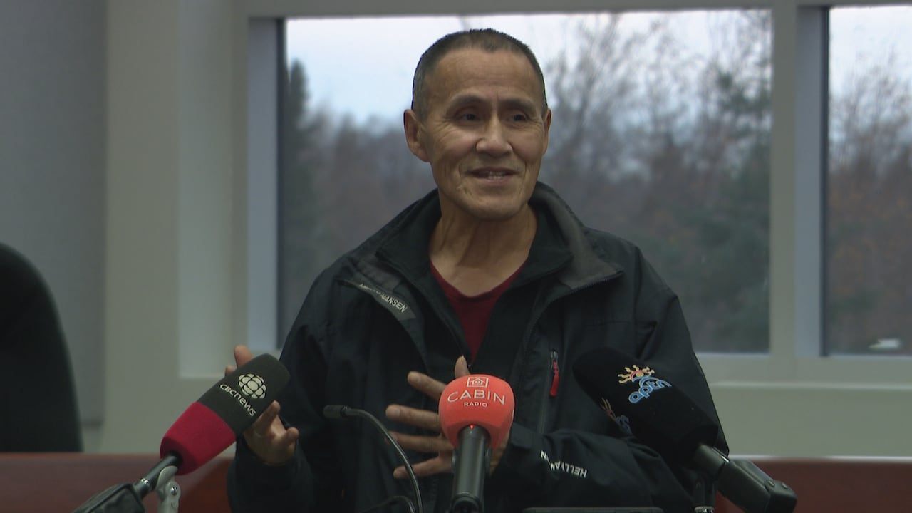 A man speaking at a podium