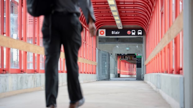 Blair station on Sept. 6, 2019. A person walks down a long red hallway.