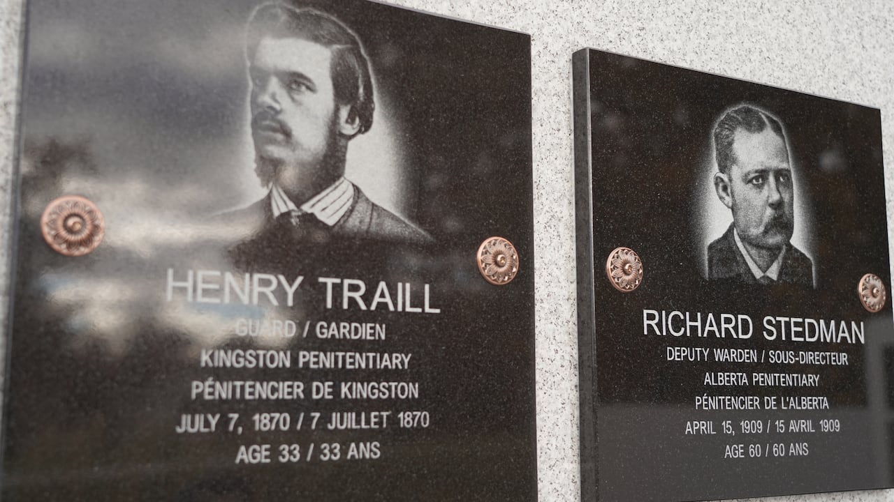 A photograph  of a memorial plaque showing a antheral   with agelong  acheronian  hairsbreadth  and a abbreviated  goatee.