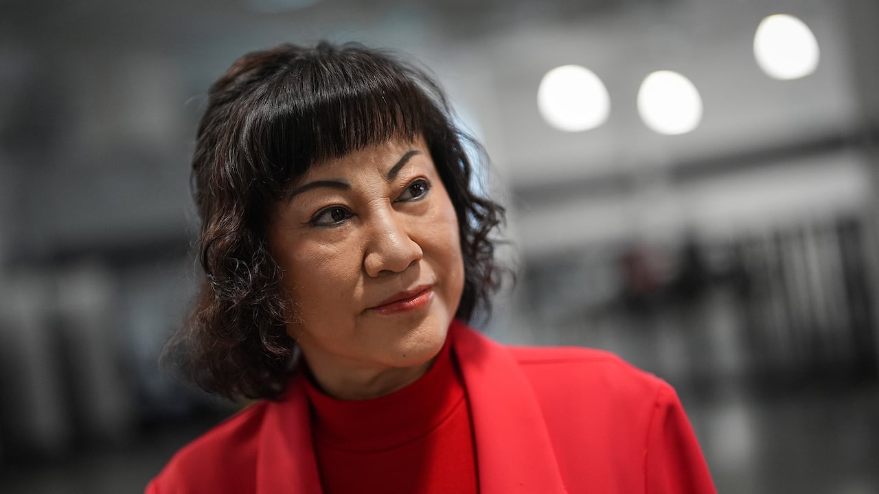 Woman in a red suit.