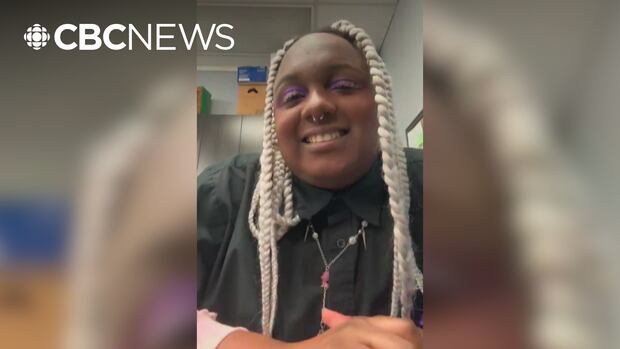 A Black woman with white braids smiles in a Zoom window.