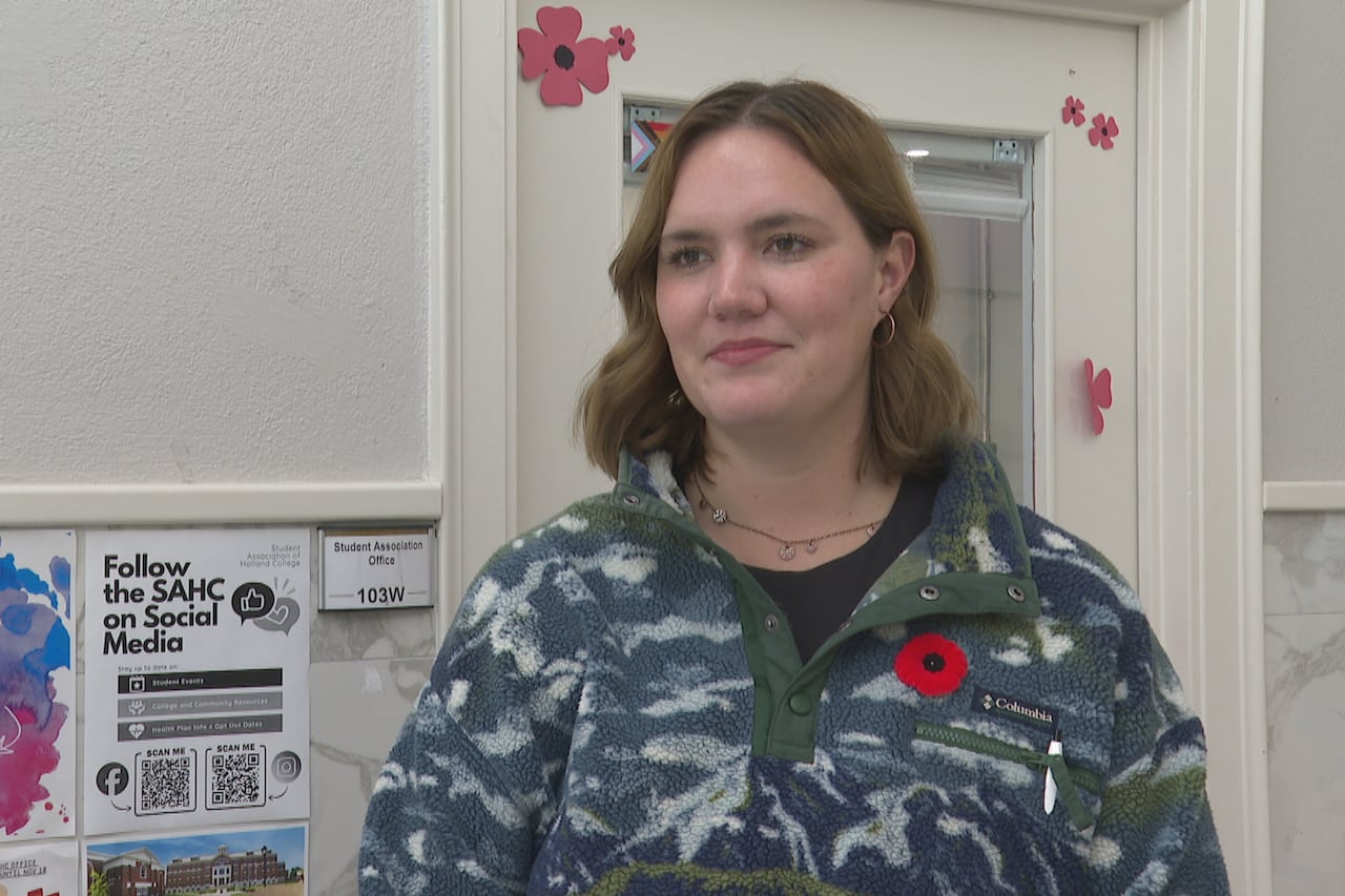 a young pistillate wearing a fleece apical and a poppy.
