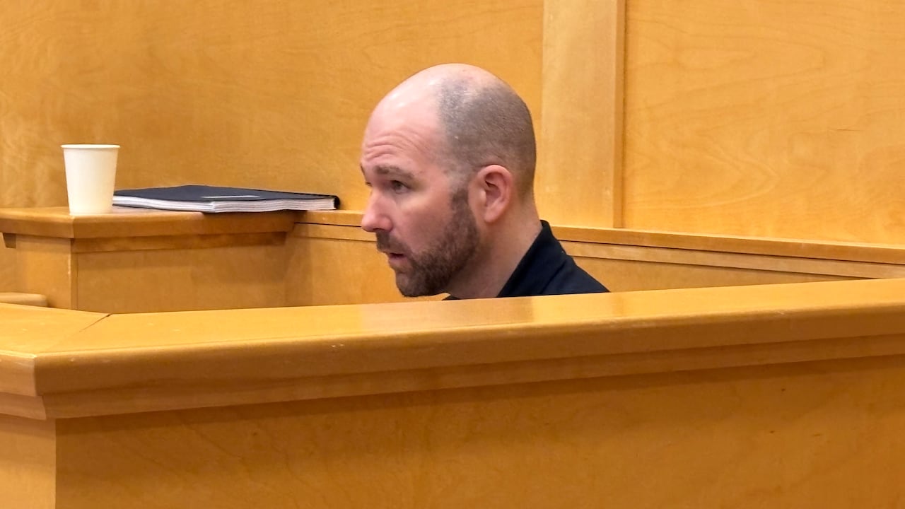 A antheral   sitting successful  a courtroom box.