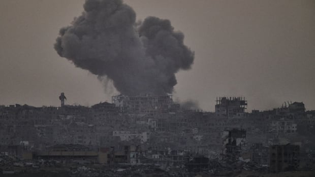 moke rises amid buildings, that were destroyed during the Israeli ground and air operations