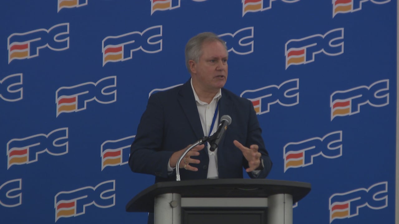 A man speaking at a podium.