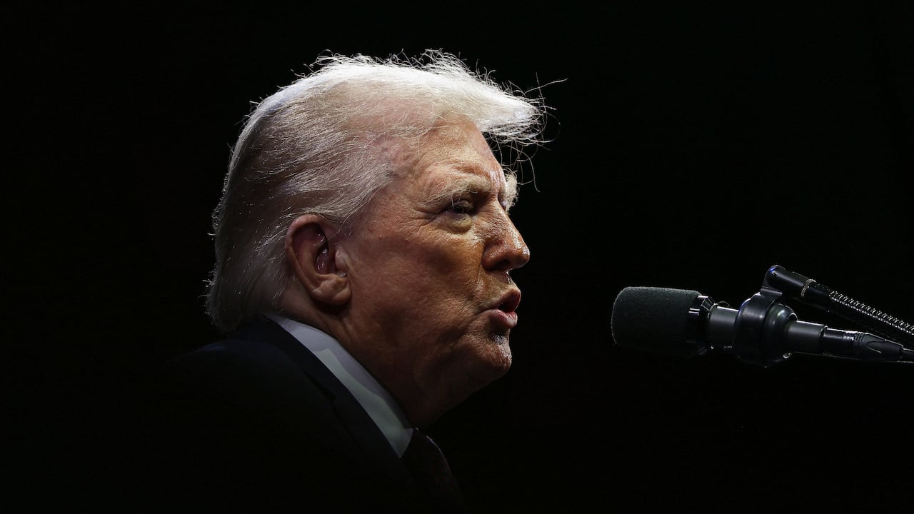 The silhouette of a man with blonde hair.
