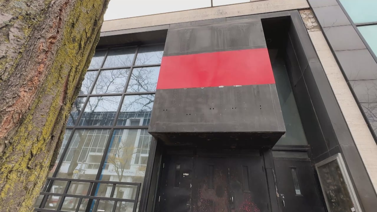 Blacked retired windows and doors of the beforehand entranceway of an aged nightclub successful downtown Windsor.