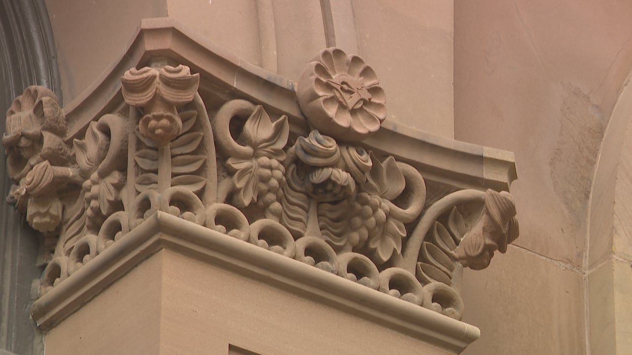 A pillar with stone carvings.