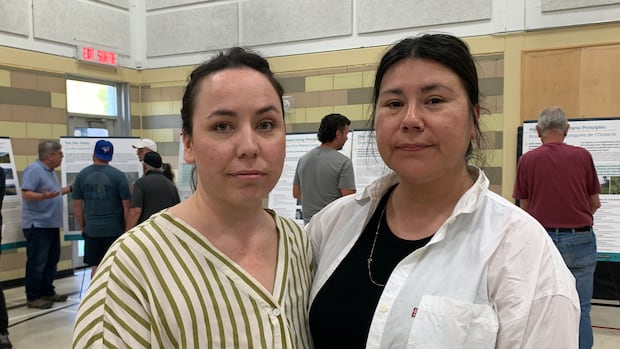A photo of two Algonquin leaders at a public meeting