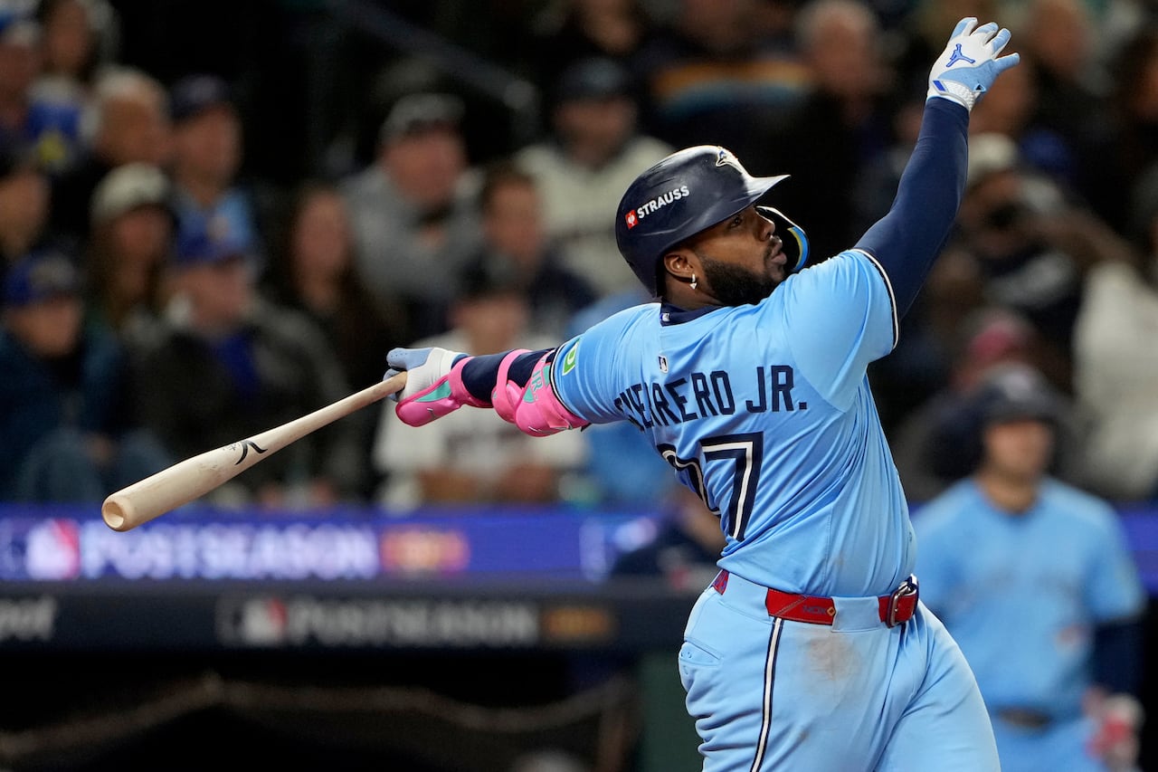 A baseball player who just swung a bat