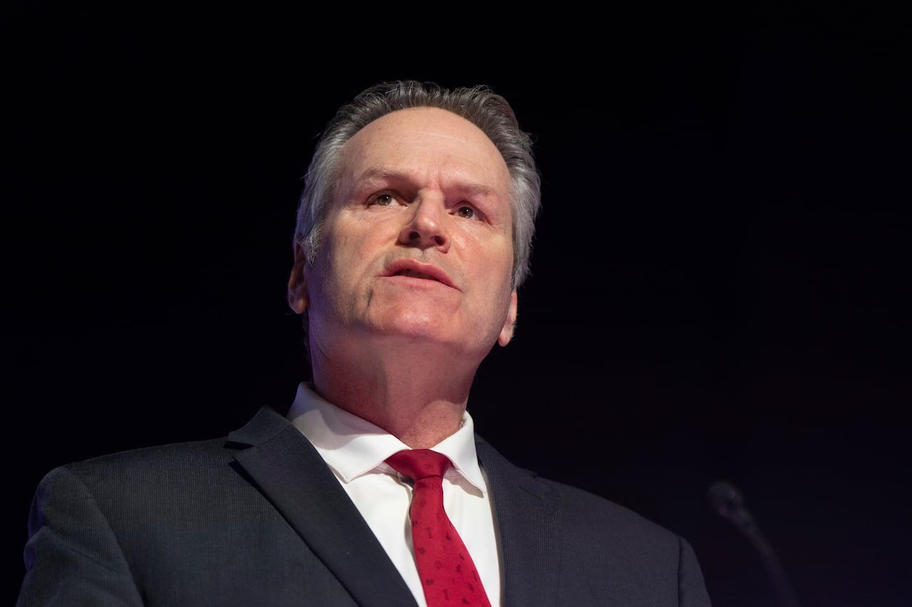 A close up of a man in a suit.