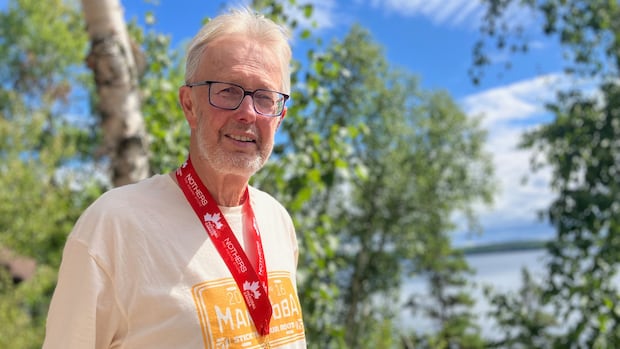 Mac Horsburgh is seen in a picture takin during the summer of 2025 after winning the title of pickleball national champion. A man smiles with a medal on his neck.