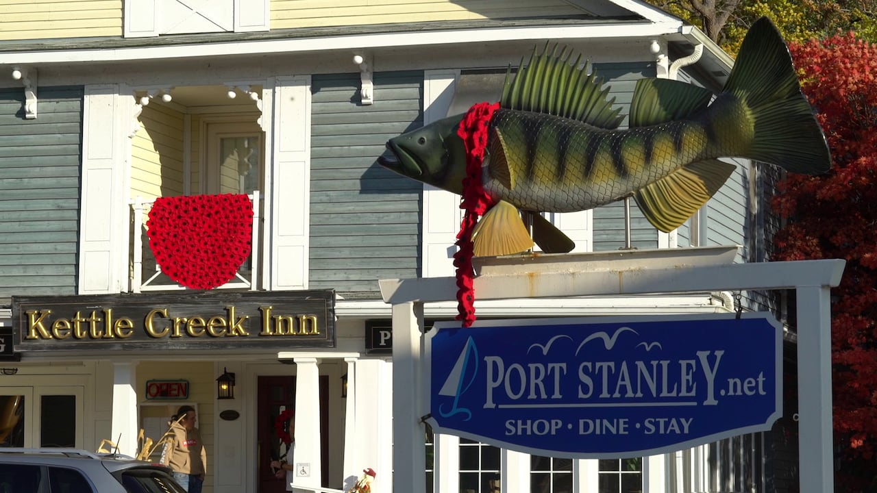 Port Stanley's iconic welcome sign was sporting new fashion when photographed wearing a scarf made entirely from poppies on Nov. 3, 2025.