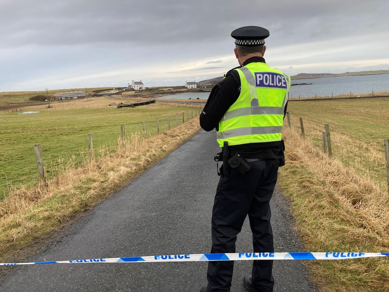 The police officer standing at the closet on Sandning, a town in Scotland's Shetland Islands, February 2024.