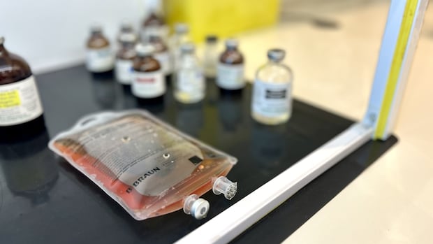 An intravenous mixture sits in a sterile area of a wellness clinic, prior to being given to a customer. 