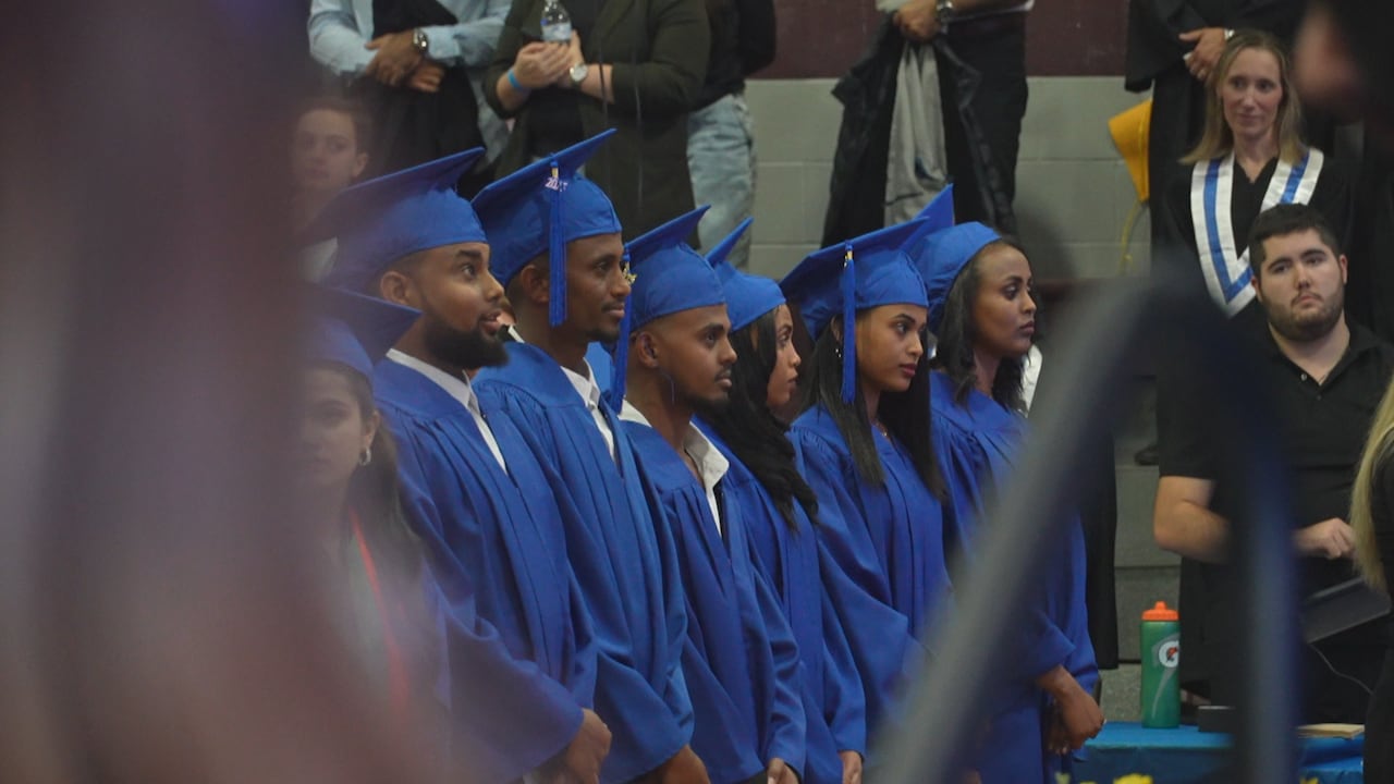 The six Teslfalem Arey brothers wait to be called by name during the graduation ceremony.