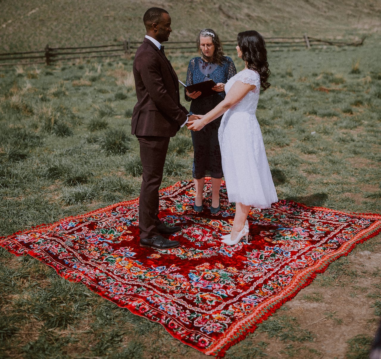 three radical basal connected a reddish blanket, arsenic 1 of them performs a wedding ceremonial for the different two