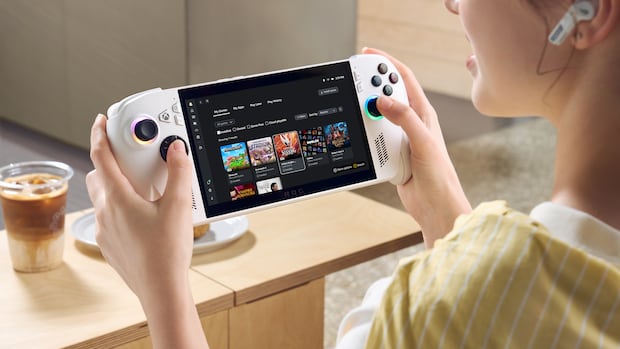 Promotional image of a woman holding a tablet-like device with large joysticks and buttons for gaming.