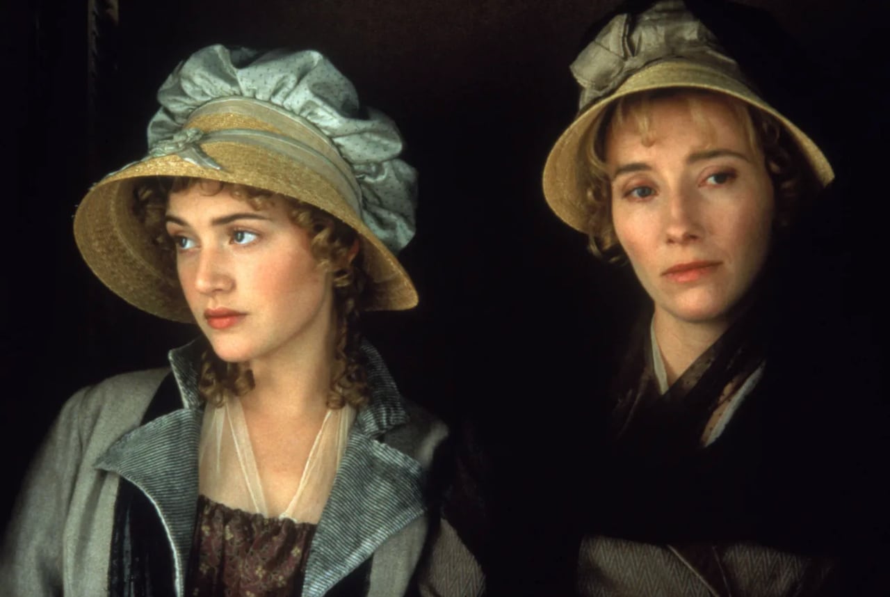 Closeups on 2 women dressed in 18th century clothing. 