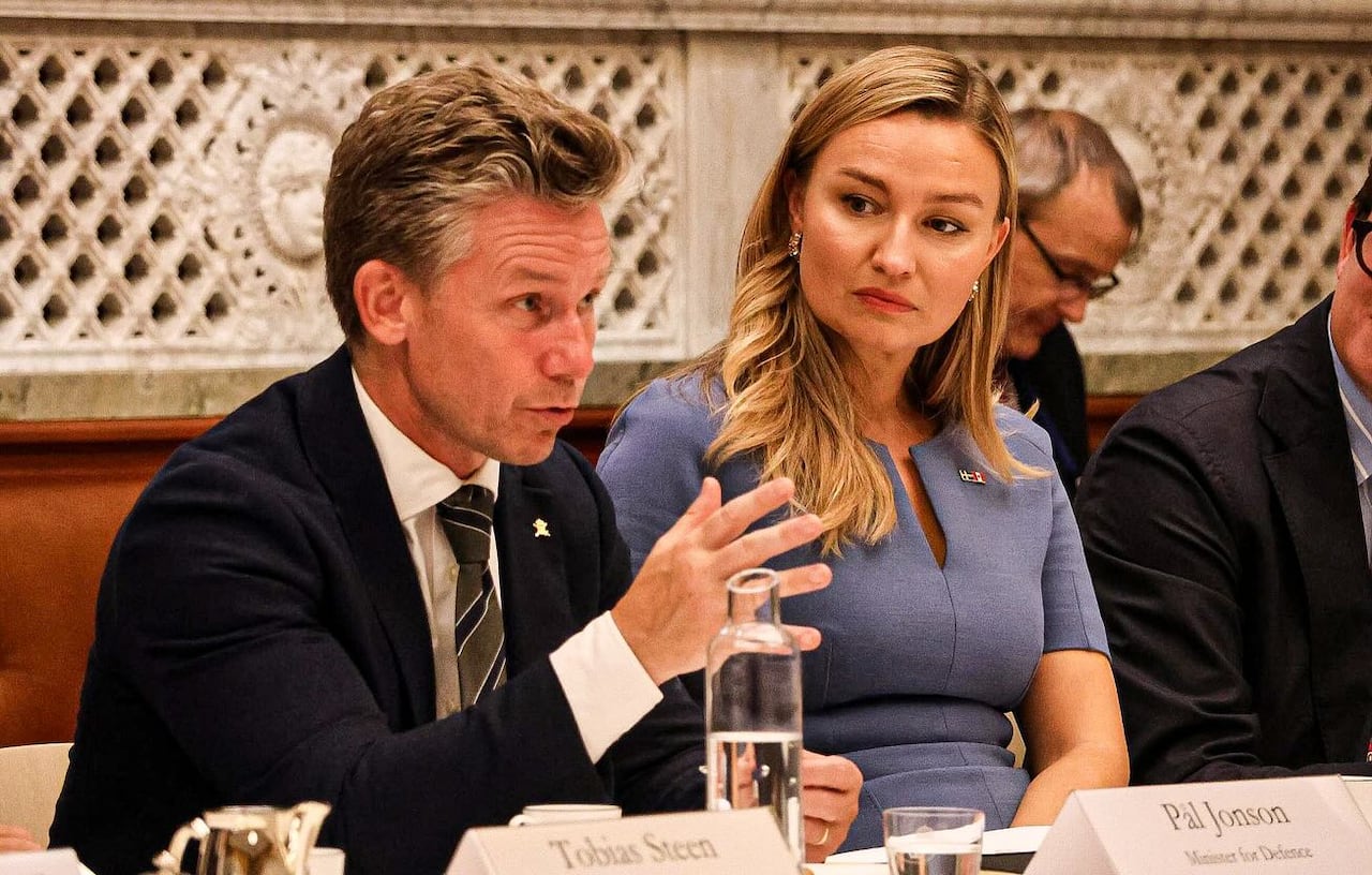 Two people sitting at a table.