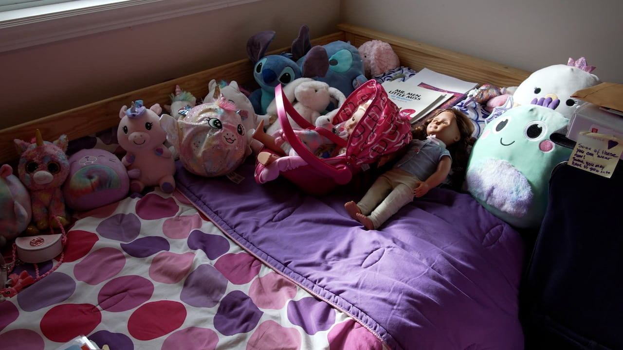 Children's bed with stuffed animals.
